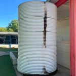 repairing damaged section of water tank