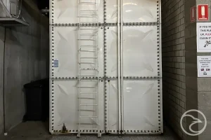 grp water tank showing signs of wear and damage